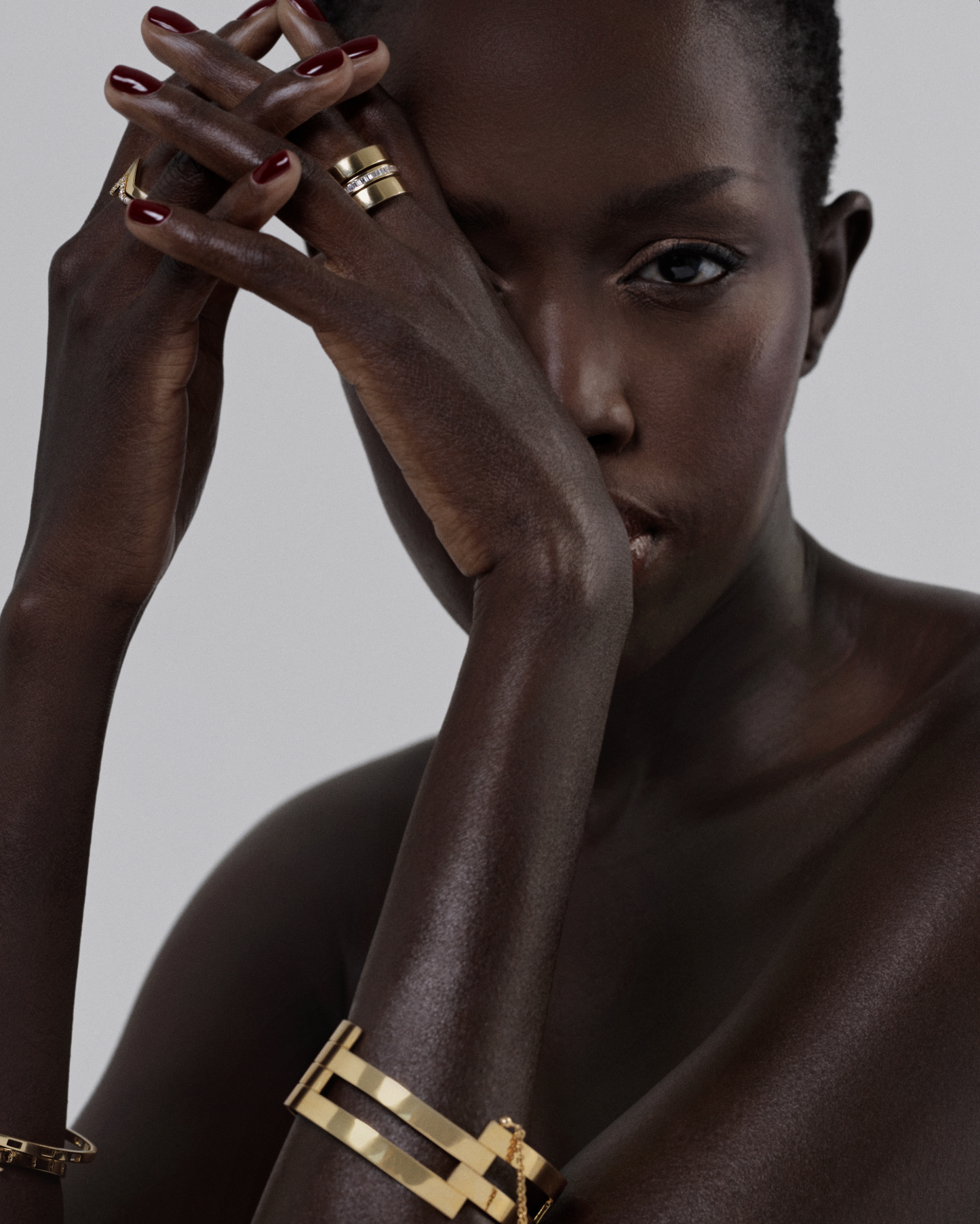 Femal model wearing a gold triple band ring