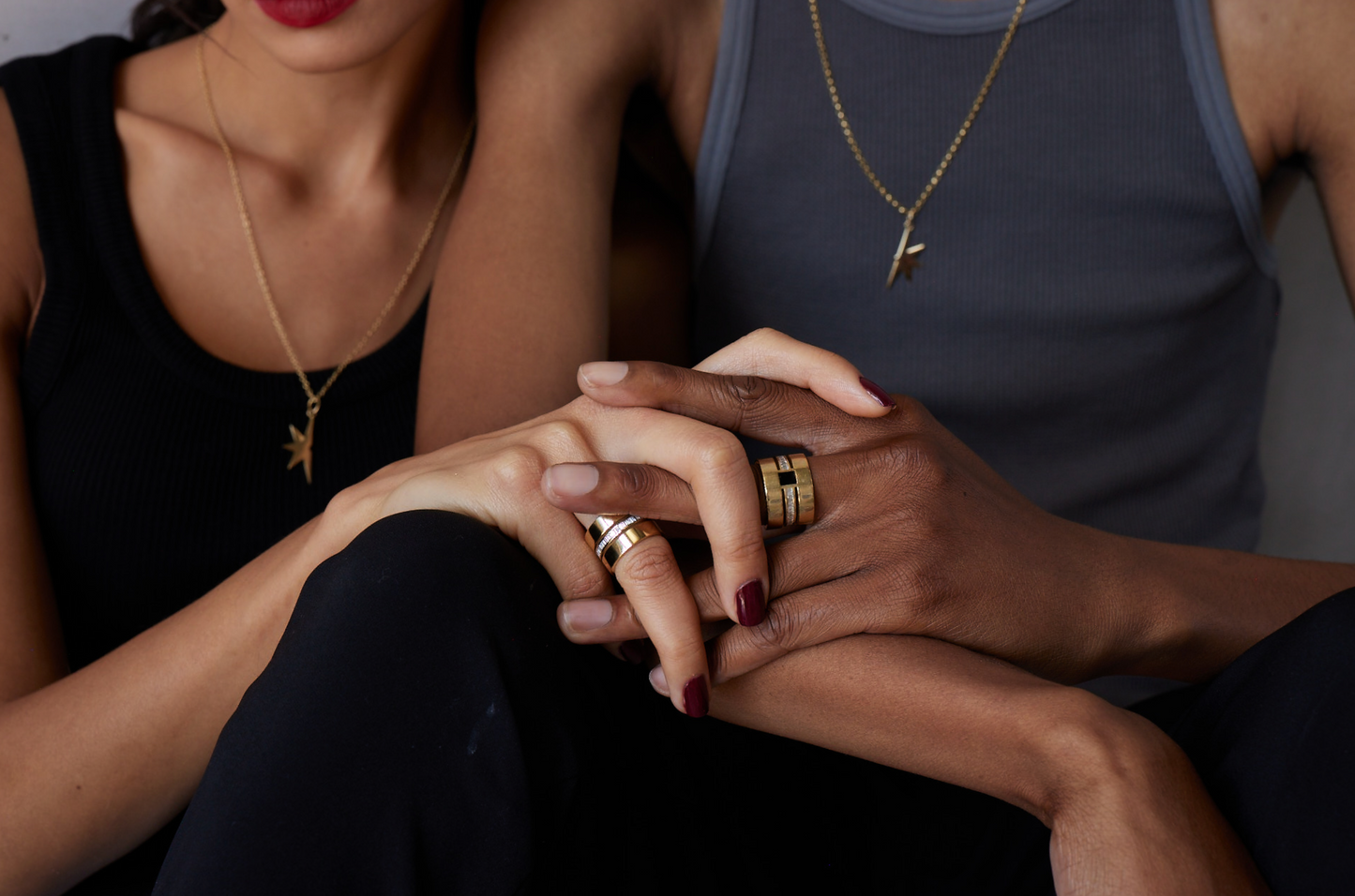 His and her matching triple band cigar band rings with baguette diamonds and black enamel