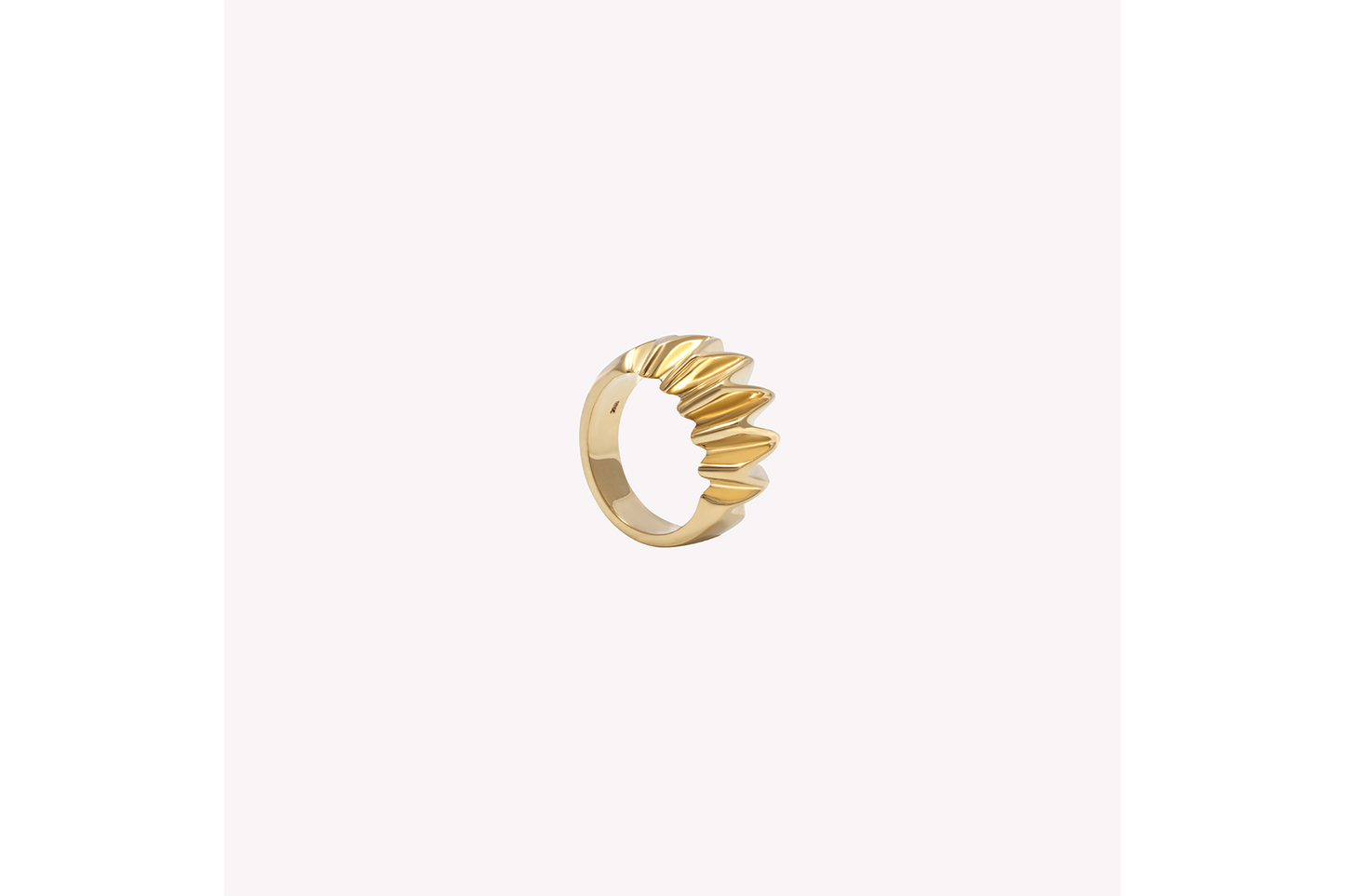 a gold textured pinky ring