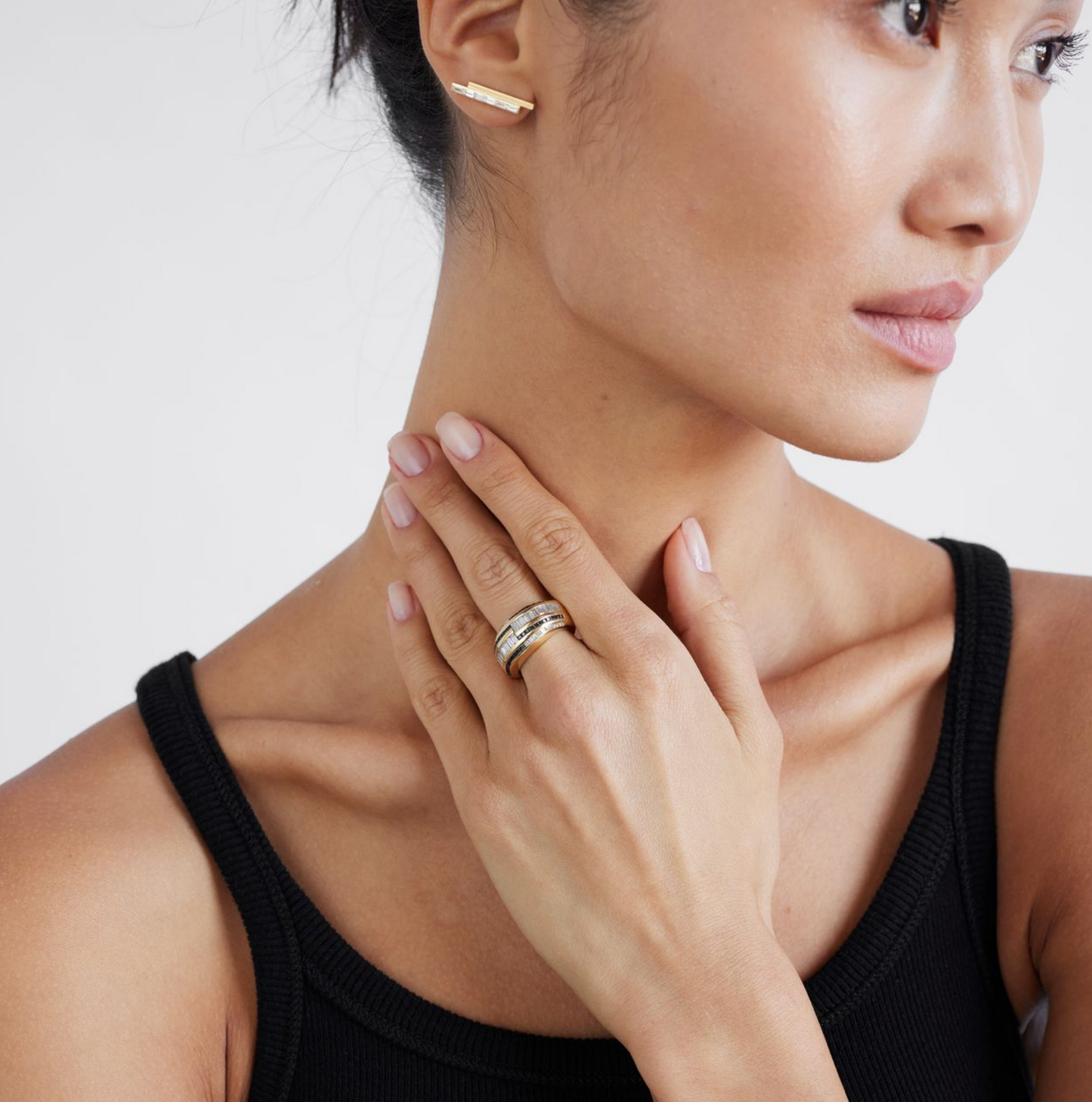 a domed yellow gold cocktail ring with sapphires and diamonds