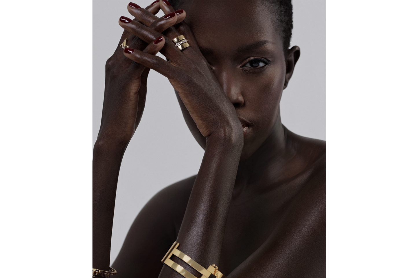 model wearing a multi-band gold cuff