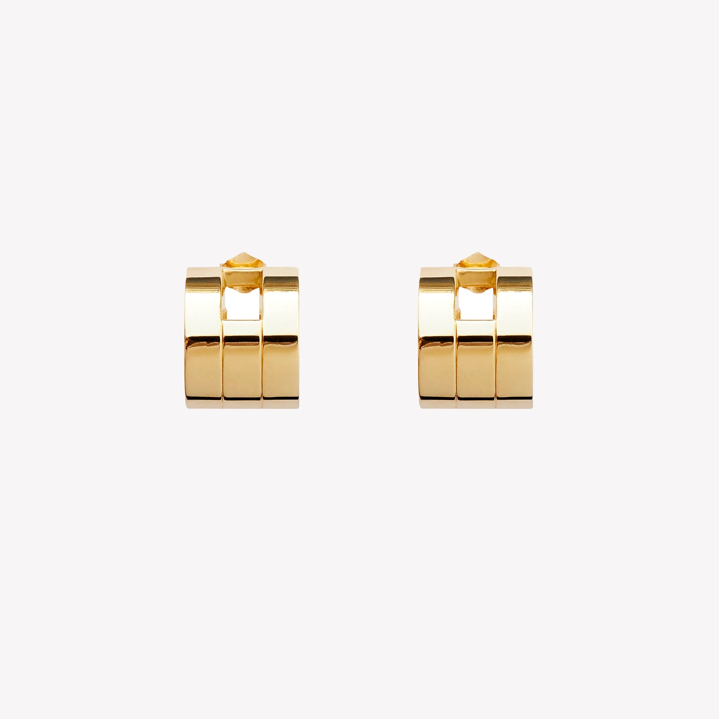 A pair of chunky gold hoop earrings with a geometric design, part of the Margueritte collection.