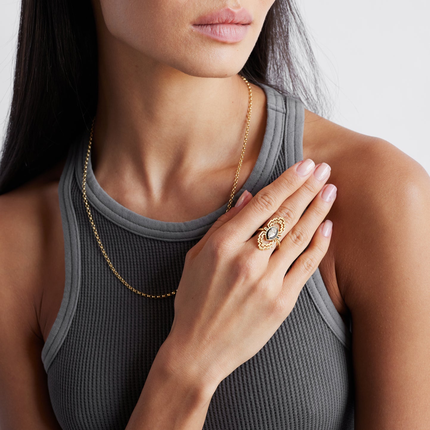 maze motif solid gold ring set with a one carat antique marquise diamond