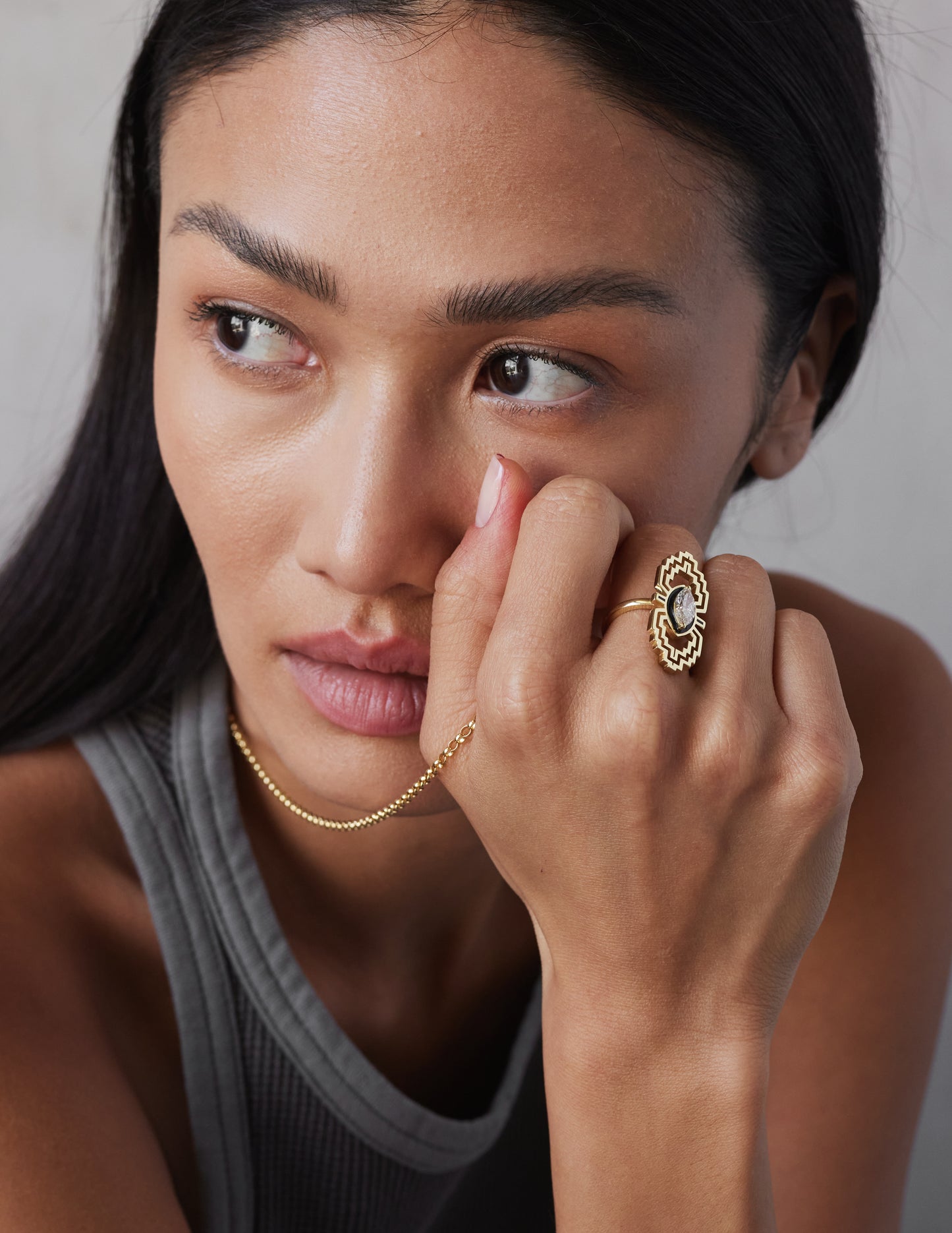 female model wearing a marquise diamond ring