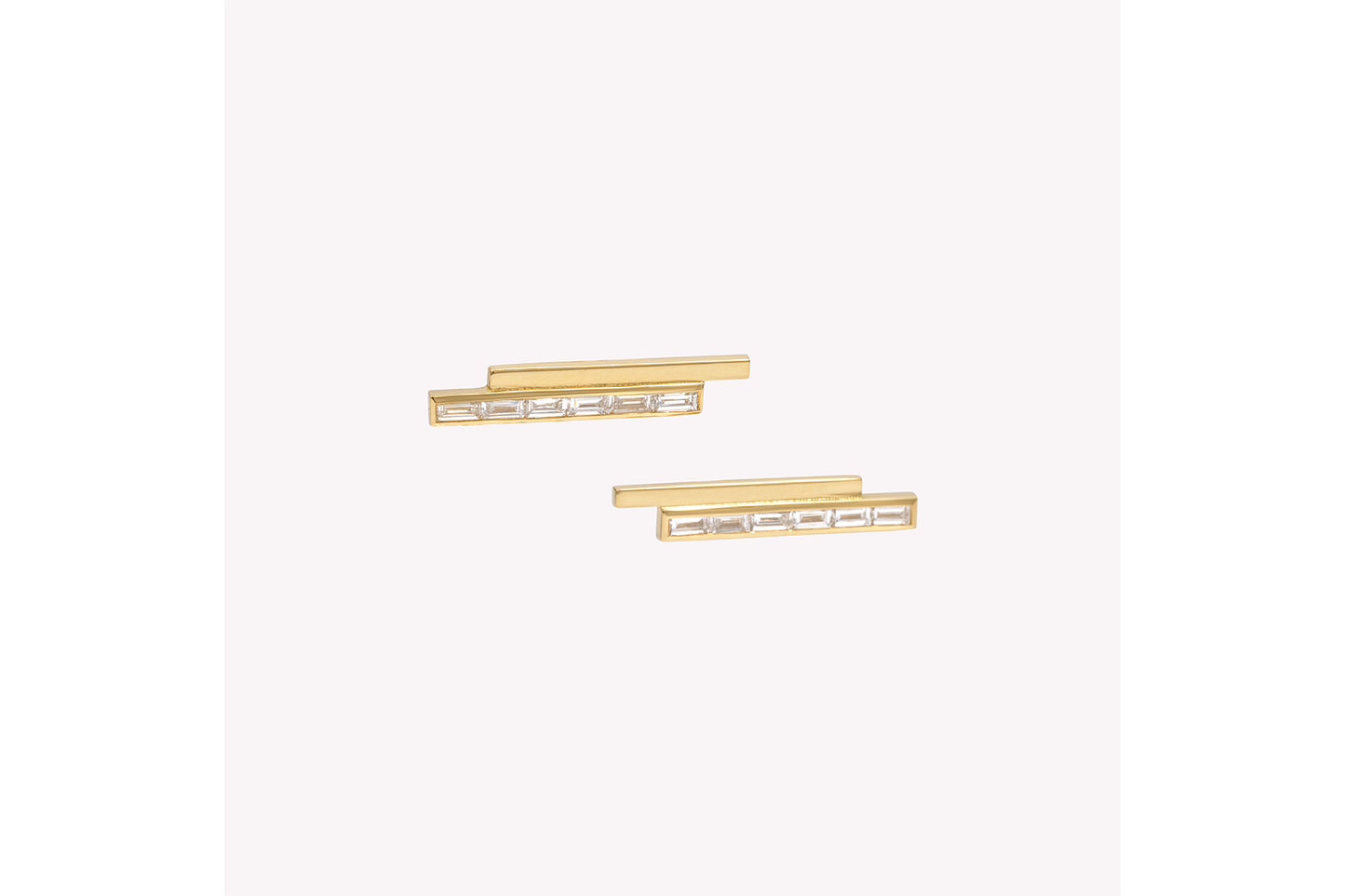 A pair of gold stud earrings with pinstripe bar design set with either diamonds or emeralds.