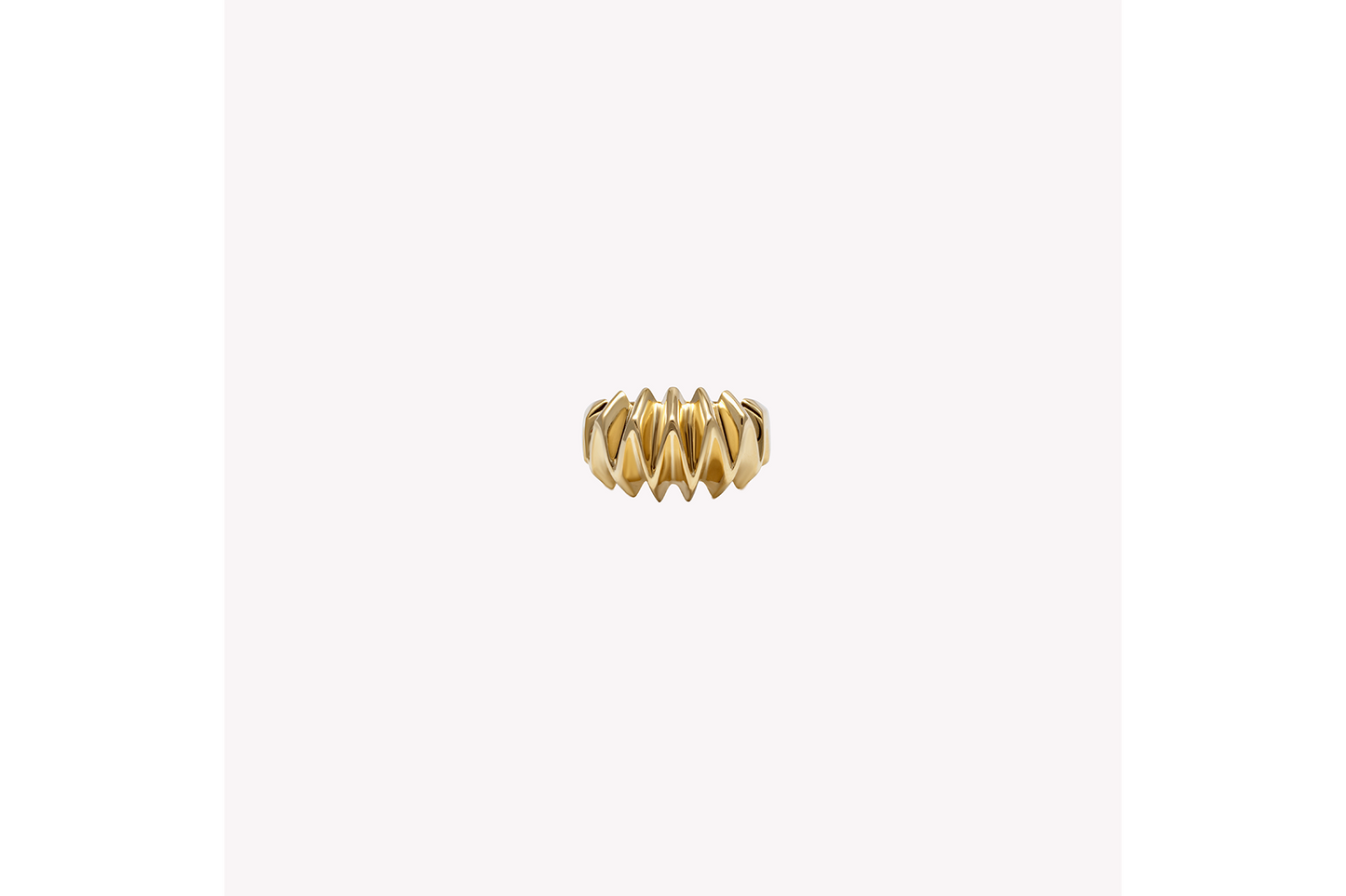 A textured, gold-colored pinky ring ring handcrafted in 18k recycled gold, displayed against a white background.