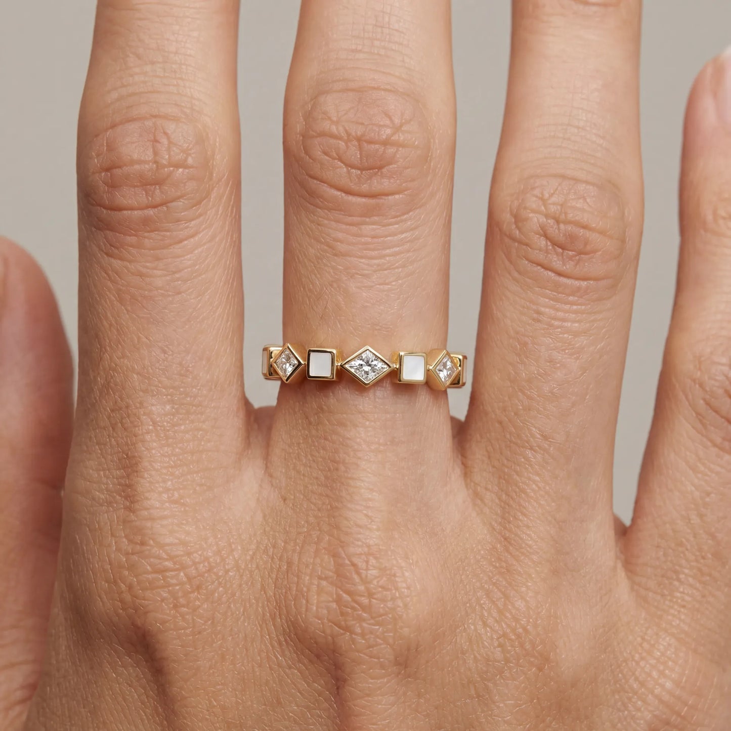 18k gold ring with kite shape diamonds and white enamel cubes