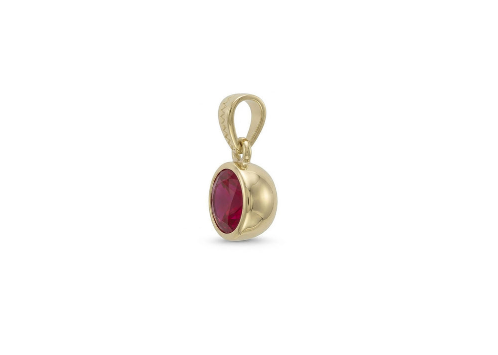 18k gold charm with ruby