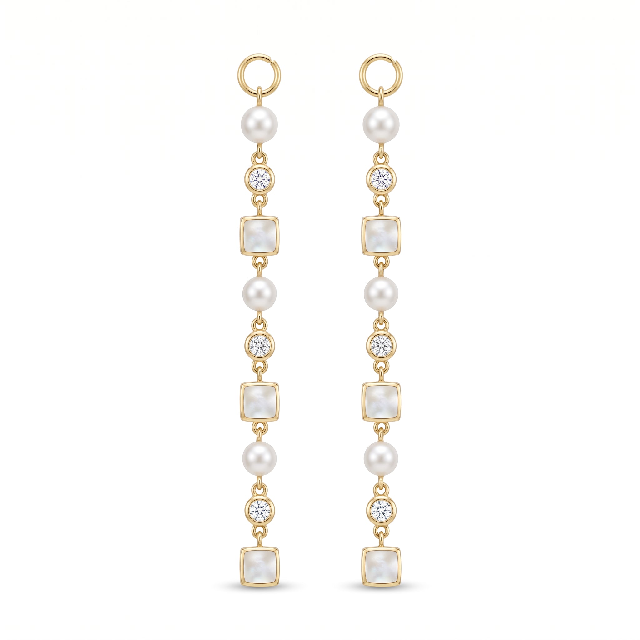 A pair of gold drop earrings featuring white pearls, square pearl-like beads, and old european cut diamonds, shown on a plain white background.