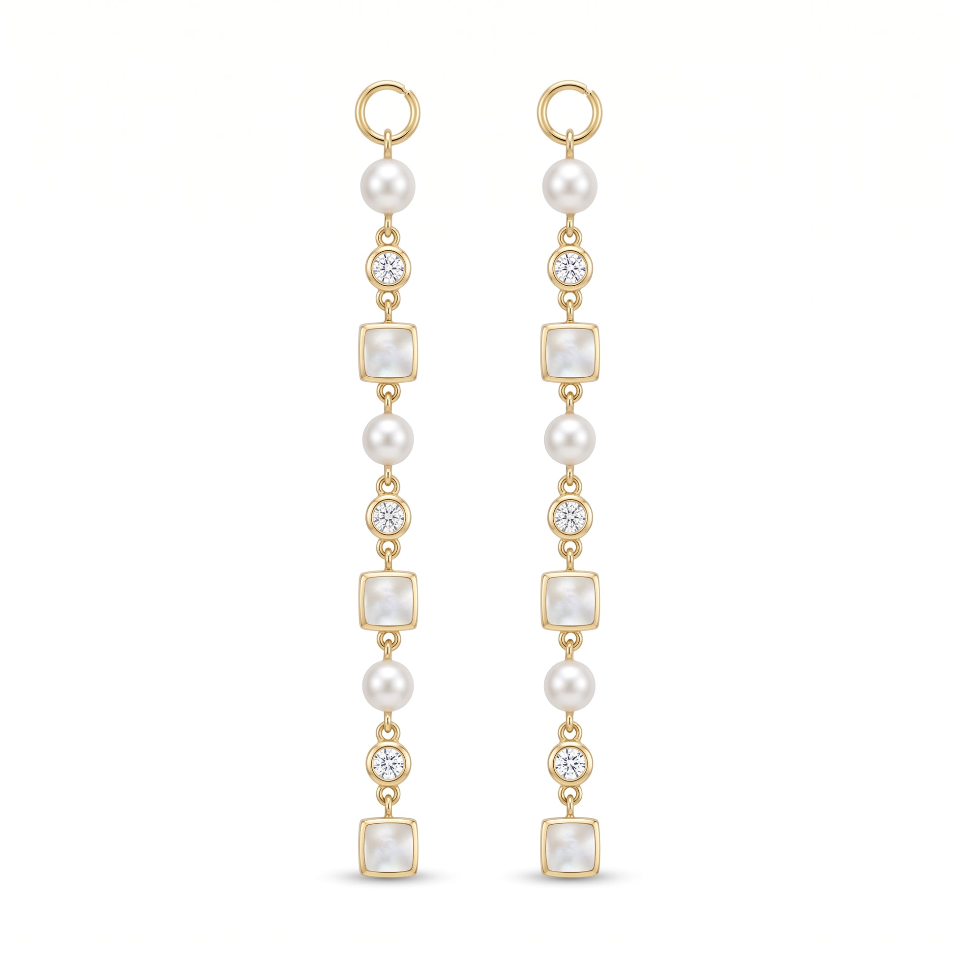A pair of gold drop earrings featuring white pearls, square pearl-like beads, and old european cut diamonds, shown on a plain white background.