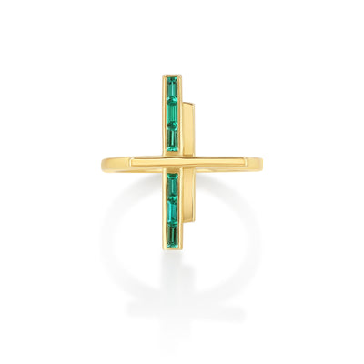 A gold ring with a geometric design featuring two vertical polished gold bars and one horizontal bar set with baguette cut emeralds.