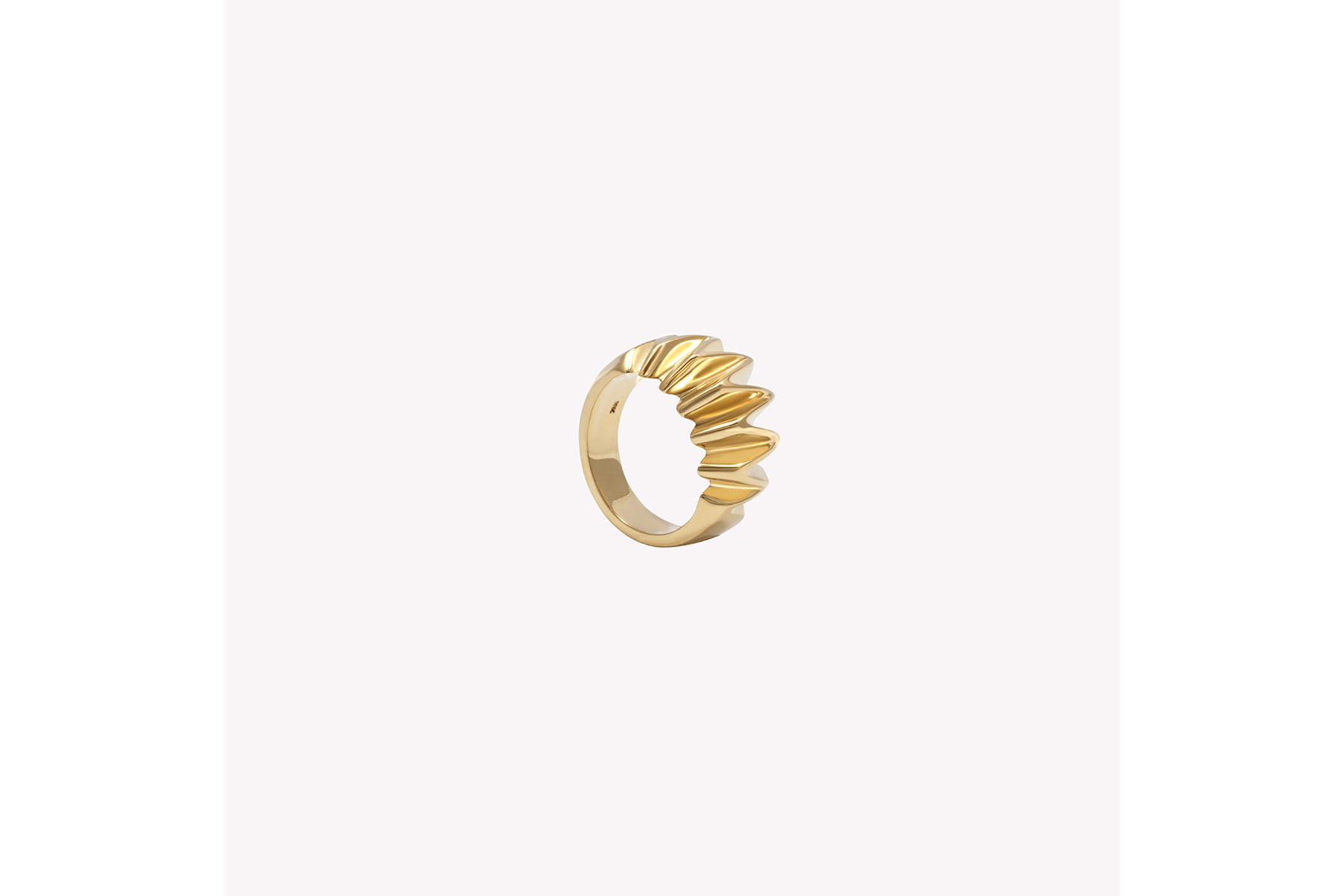 a gold textured pinky ring