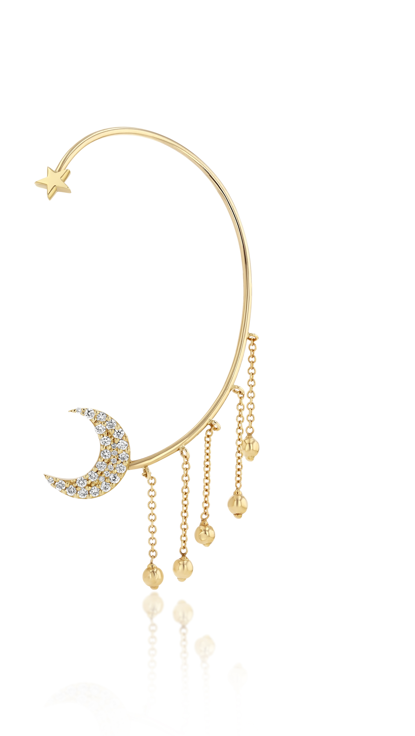 A gold ear cuff featuring a crescent moon design with pavé diamonds and dangling gold balls on a white background.