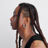 male model wearing double sided white gold and diamond hoops