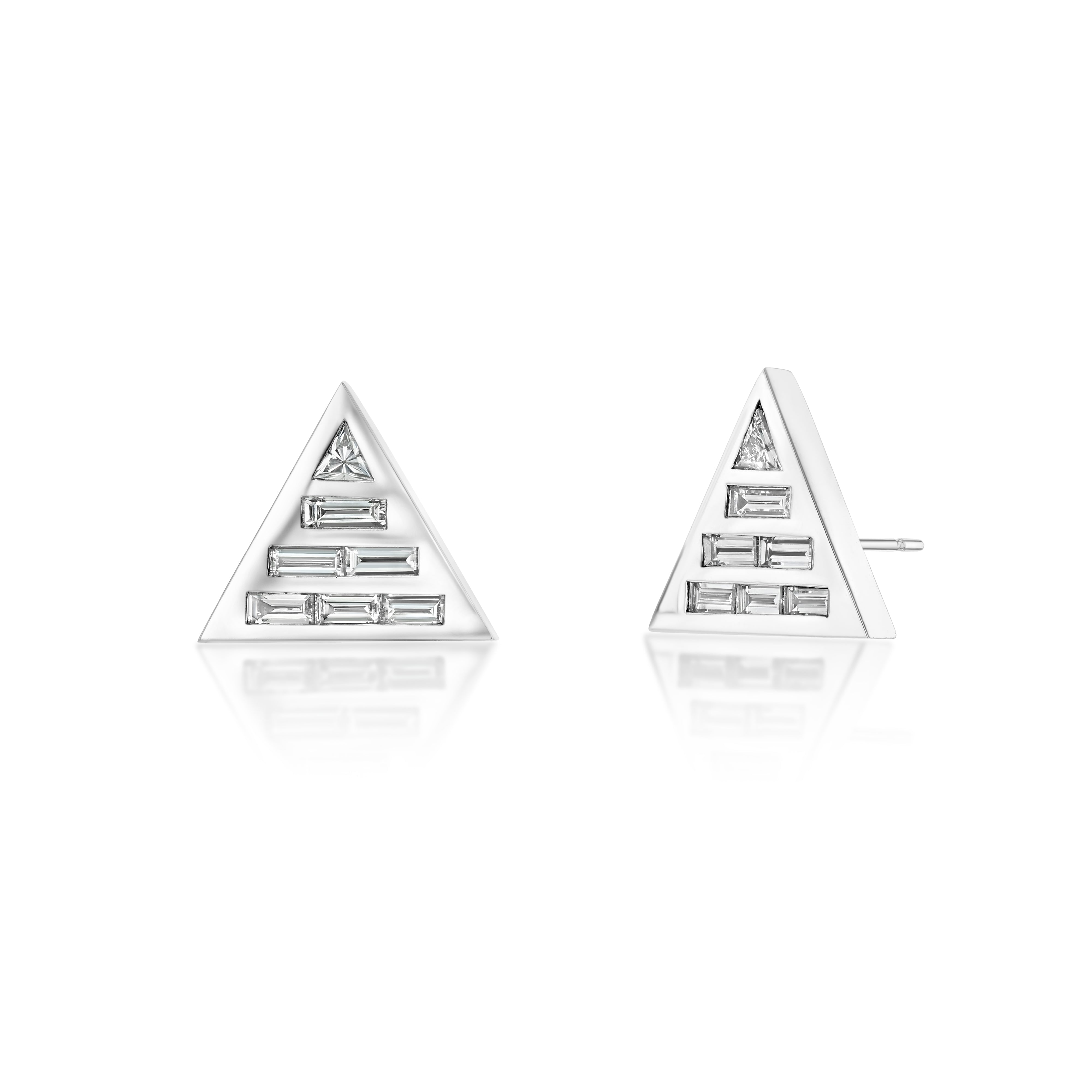 A pair of 18k recycled white gold studs earrings set with natural baguette and custom-cut trillion diamonds.