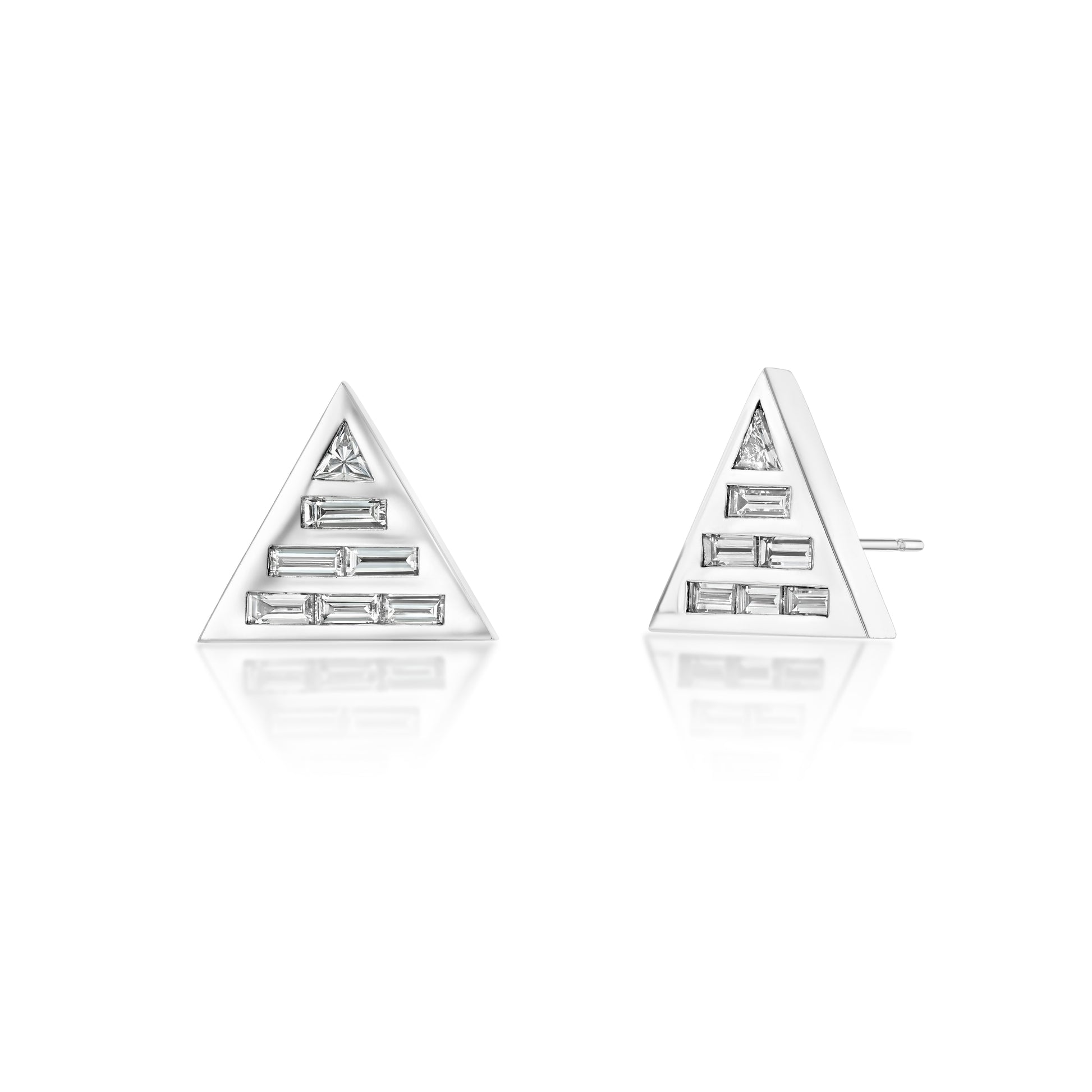 A pair of 18k recycled white gold studs earrings set with natural baguette and custom-cut trillion diamonds.