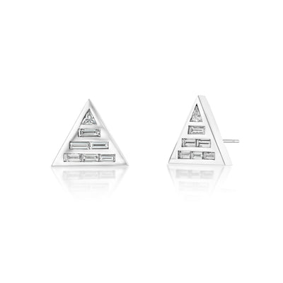 A pair of 18k recycled white gold studs earrings set with natural baguette and custom-cut trillion diamonds.