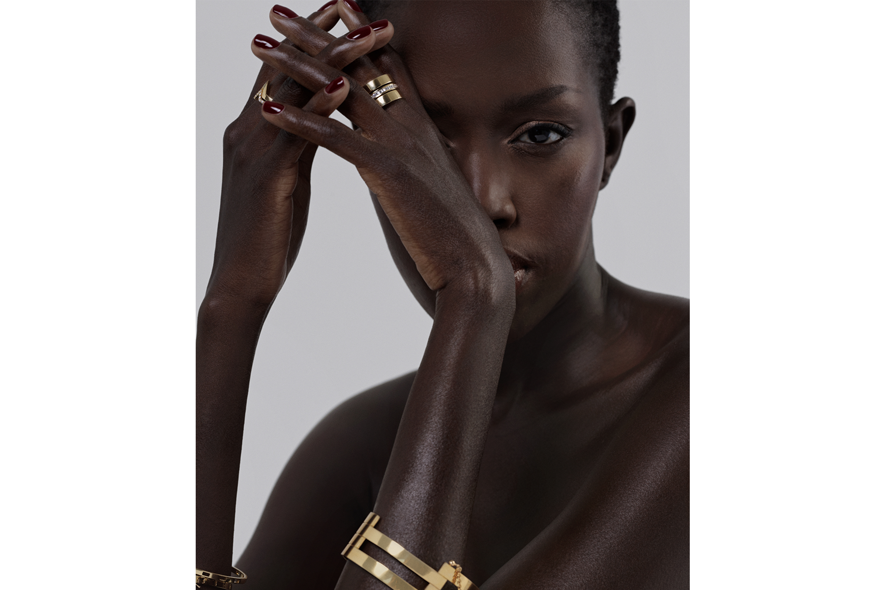 model wearing a multi-band gold cuff