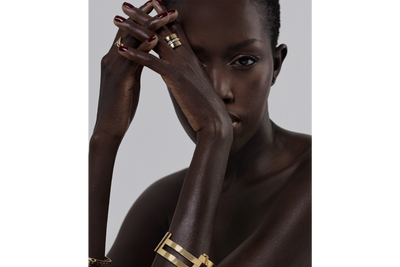 model wearing a multi-band gold cuff