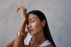 model wearing a multi-band gold cuff