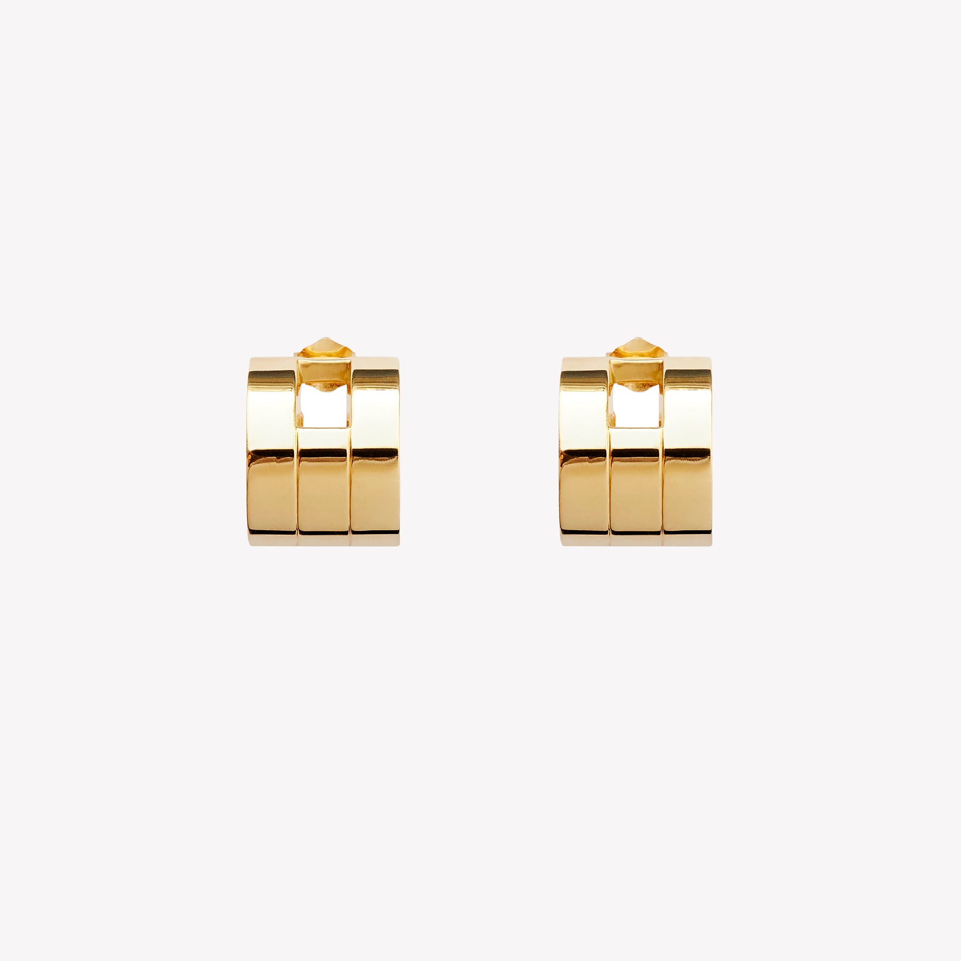 A pair of chunky gold hoop earrings with a geometric design, part of the Margueritte collection.