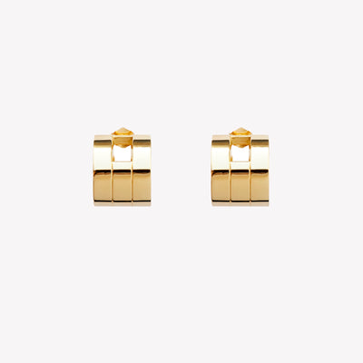 A pair of chunky gold hoop earrings with a geometric design, part of the Margueritte collection.