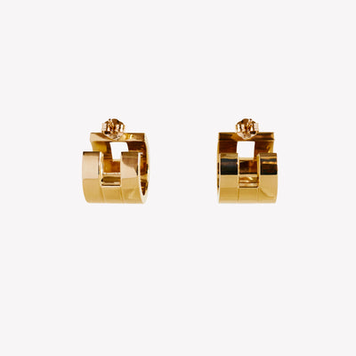 A pair of chunky gold hoop earrings with a geometric design, part of the Margueritte collection.