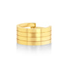 Gold ring with horizontal stripes on a white background
