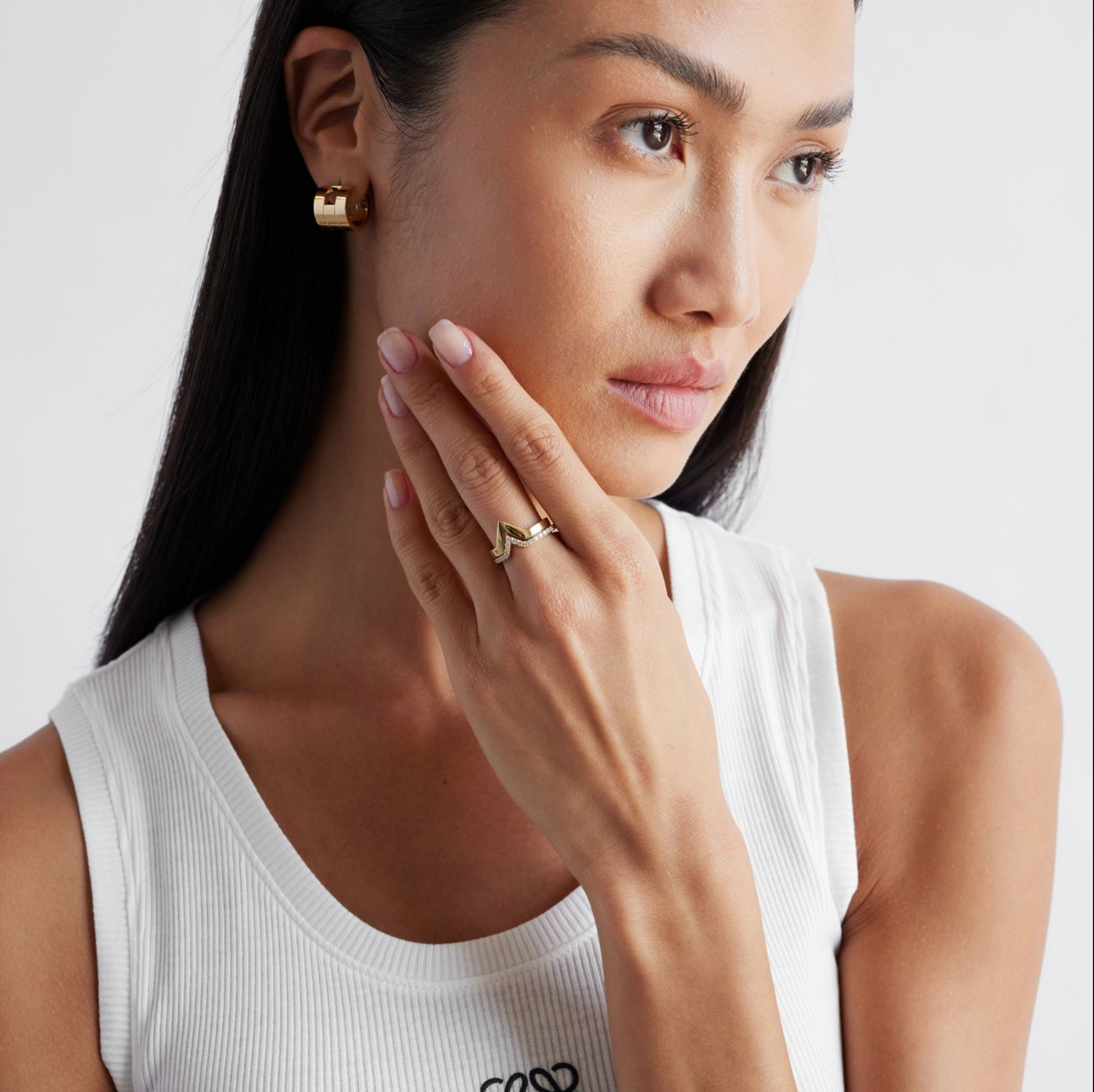 model wearing the stacking yellow gold rings