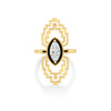 Gold art deco ring with a central gemstone on a white background