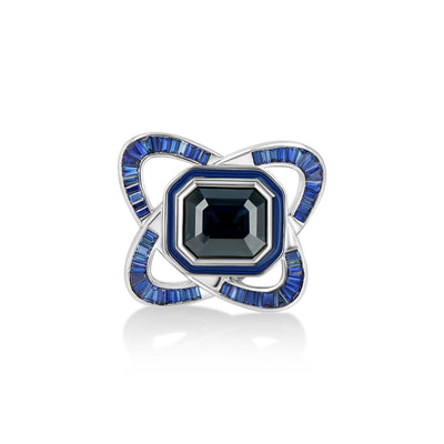 A LÖF statement ring in 18k solid white gold, with custom cut sapphires and blue spinel