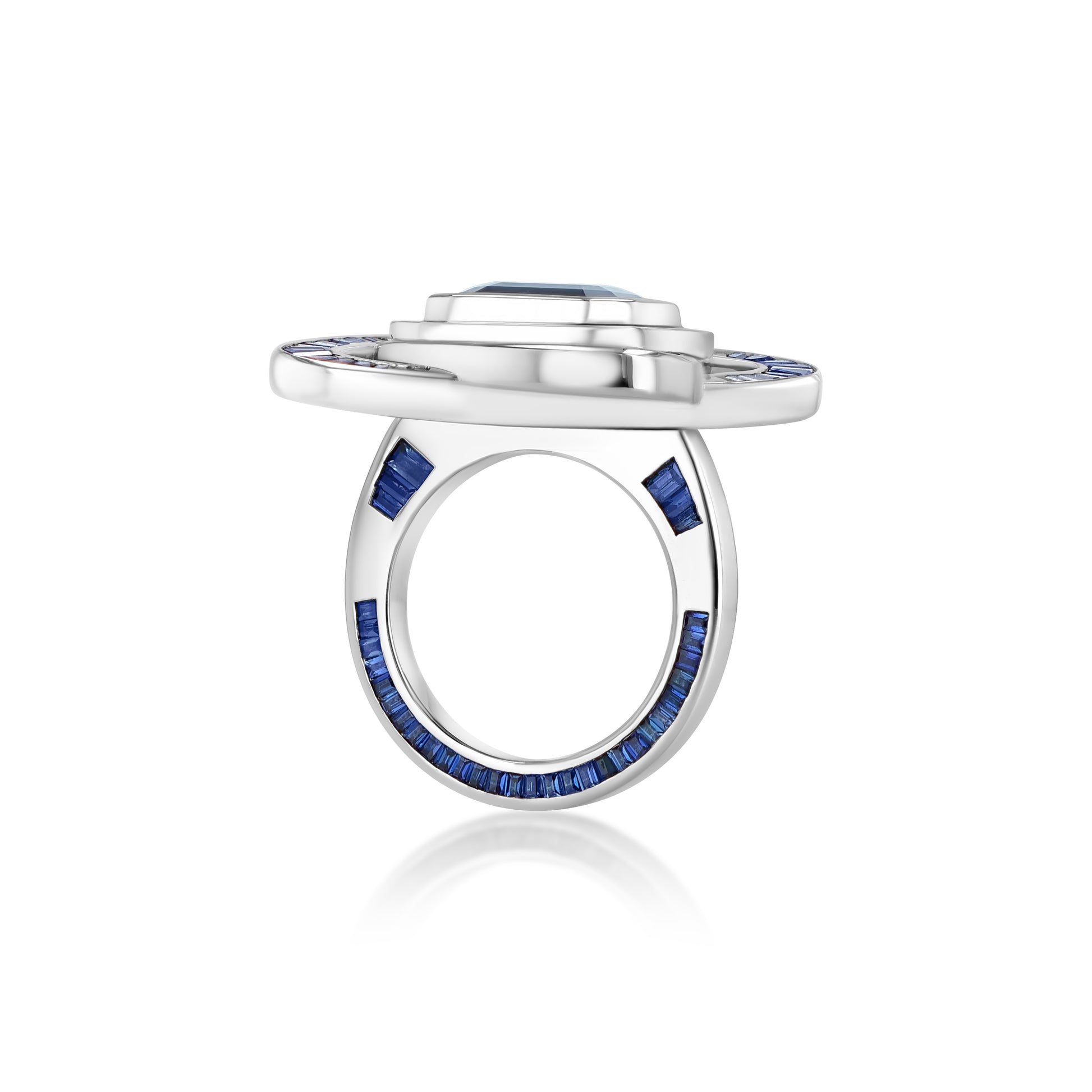 A LÖF statement ring in 18k solid white gold, with custom cut sapphires and blue spinel