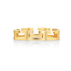 A unisex 18k yellow gold band ring with a geometric pattern of laser-cut shapes creating a negative space design.