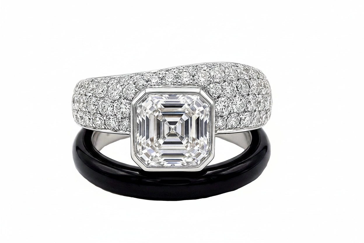 Diamond and white sapphire ring with a black onyx and on a white background