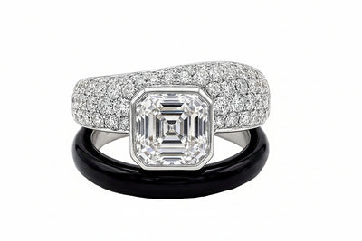 Diamond and white sapphire ring with a black onyx and on a white background