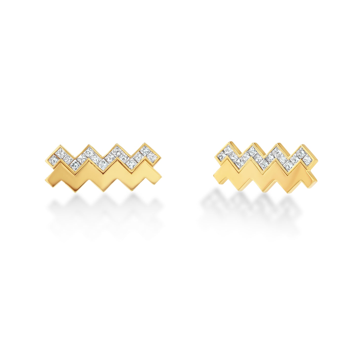 A pair of zigzag stud earrings set with natural diamonds, handcrafted in 18k recycled gold.
