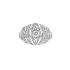 A vintage-style dome-shaped ring with a central diamond surrounded by smaller diamonds set in 18k white gold.