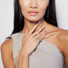female model wearing a vintage-style dome-shaped ring with a central diamond surrounded by smaller diamonds set in 18k white gold.